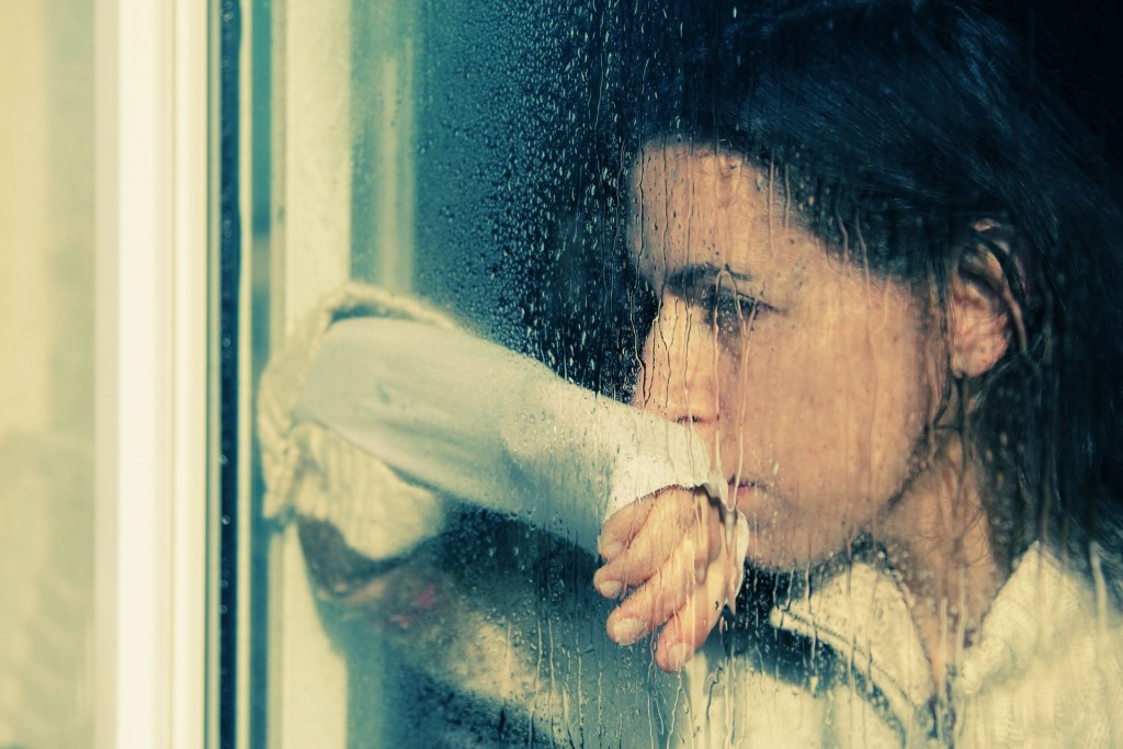 Just another depressed lady, staring out a window on a rainy day.